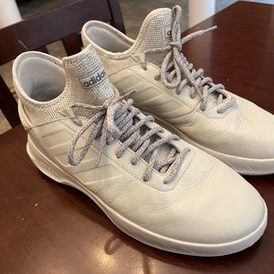 White adidas sneakers.